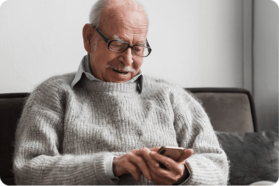 Elderly man using smartphone